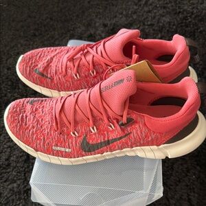 Nike Pink Sneakers with Knit Upper and Streamlined Design